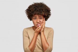 Woman experiencing tooth pain